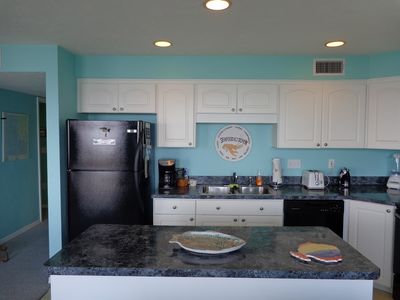 View from Dining Area into Kitchen with all Frigidaire appliances.